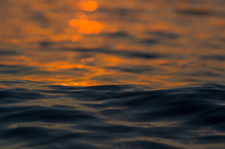 Summer sea sunset, the sun, waves and clouds, beautiful dramatic lighting