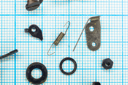 parts are completely disassembled old retro film SLR camera on graph paper, close-upの写真素材