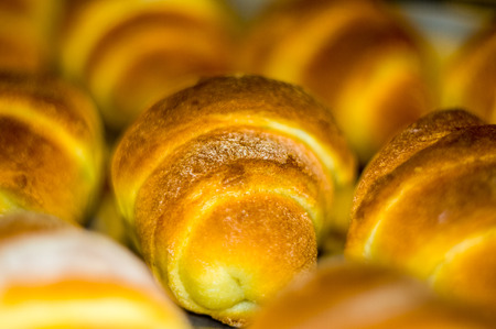 Fresh homemade croissants with sweet filling, before baking in the oven, selective focusの写真素材