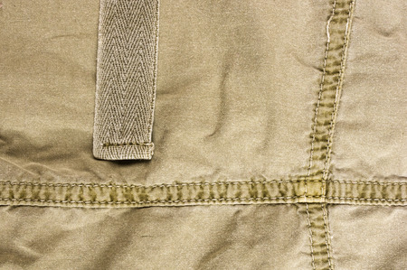 clothing items washed cotton fabric texture with seams, macro, close-up