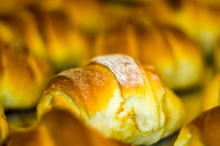 Fresh homemade croissants with sweet filling, before baking in the oven, selective focusの写真素材