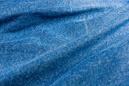Blue washed faded jeans texture with seams, clothing items, macro, close-up