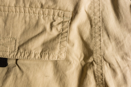 clothing items washed cotton fabric texture with seams, macro, close-upの写真素材