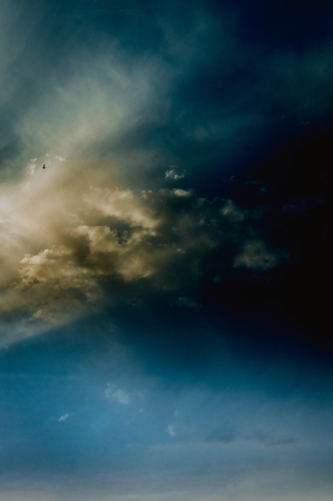 Landscape with dramatic light - beautiful golden sunset with saturated sky and clouds, peaceful nature serene background.の写真素材