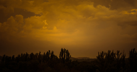 Landscape with dramatic light - beautiful golden sunset with saturated sky and clouds, peaceful...
