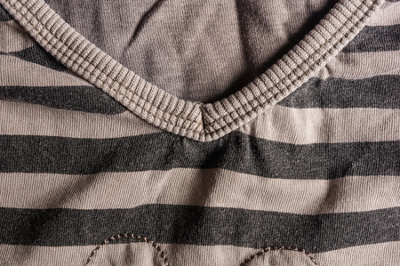 clothing items washed cotton fabric striped texture with seams, macro, close-upの写真素材