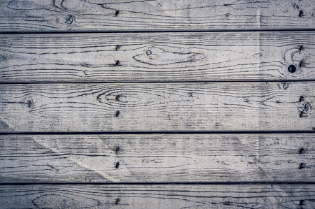 the texture of the painted shabby wooden flooring made of boards, close up, grunge backgroundの写真素材