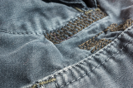clothing items washed cotton fabric texture with seams, macro, close-upの写真素材