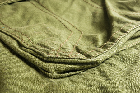 clothing items washed cotton fabric texture with seams, macro, close-up