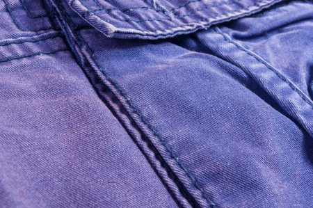 clothing items washed cotton fabric texture with seams, macro, close-upの写真素材