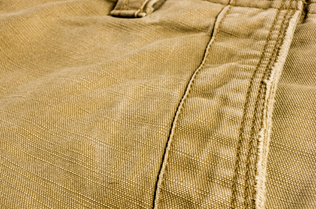 clothing items washed cotton fabric texture with seams, macro, close-upの写真素材