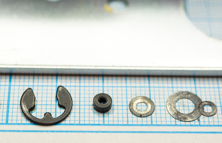 parts are completely disassembled old retro film SLR camera on graph paper, close-up