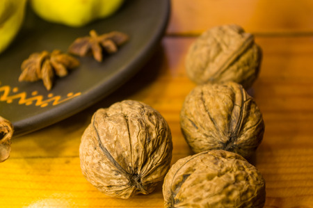 Whole walnuts on a wooden table, still life, close-upの写真素材
