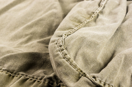 clothing items washed cotton fabric texture with seams, macro, close-up