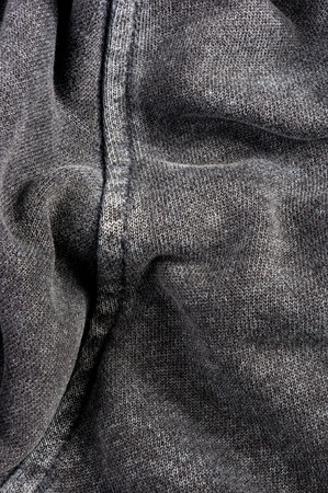 clothing items washed cotton fabric texture with seams, clasps, buttons and rivets, macro, close-upの写真素材