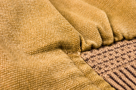 clothing items washed cotton fabric texture with seams, clasps, buttons and rivets, macro, close-upの写真素材