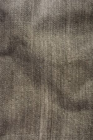 clothing items washed cotton fabric texture with seams, clasps, buttons and rivets, macro, close-up