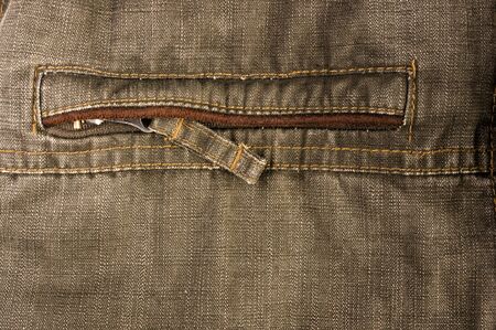 clothing items washed cotton fabric texture with seams, clasps, buttons and rivets, macro, close-up