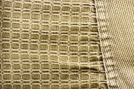 clothing items washed cotton fabric texture with seams, clasps, buttons and rivets, macro, close-up