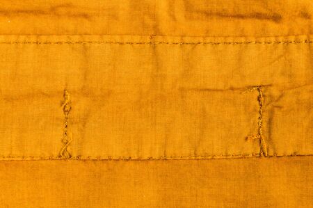 clothing items washed cotton fabric texture with seams, clasps, buttons and rivets, macro, close-up
