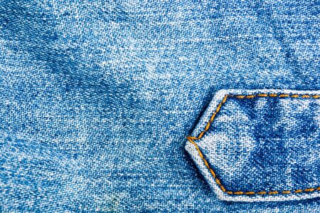 clothing items blue washed faded jeans cotton fabric texture with seams, clasps, buttons and rivets,...