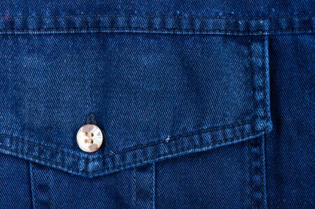 clothing items washed cotton fabric texture with seams, clasps, buttons and rivets, macro, close-upの写真素材