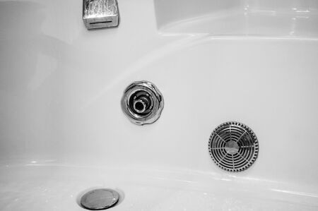 Elements of the bathroom interior-modern design, chrome details, parts of the shower cabin, plumbing.の写真素材