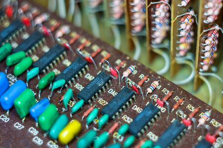 Vintage electronic circuit boards with radio parts and chips, close-up, macro photography
