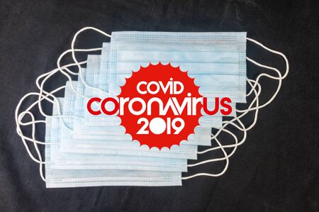 Background for news about the novel coronavirus COVID-19 - protective medical masks, thermometer and text Coronavirus COVID-19. Chinese coronavirus outbreak, Middle East respiratory syndrome coronavirus.の写真素材