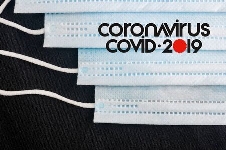 Background for news about the novel coronavirus COVID-19 - protective medical masks, thermometer and text Coronavirus COVID-19. Chinese coronavirus outbreak, Middle East respiratory syndrome coronavirus.の写真素材