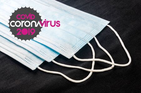 Background for news about the novel coronavirus COVID-19 - protective medical masks, thermometer and text Coronavirus COVID-19. Chinese coronavirus outbreak, Middle East respiratory syndrome coronavirus.の写真素材