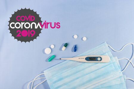Background for news about the novel coronavirus COVID-19 - protective medical masks, thermometer and text Coronavirus COVID-19. Chinese coronavirus outbreak, Middle East respiratory syndrome coronavirus.の写真素材