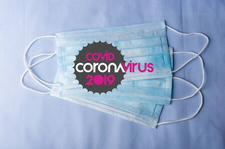 Background for news about the novel coronavirus COVID-19 - protective medical masks, thermometer and text Coronavirus COVID-19. Chinese coronavirus outbreak, Middle East respiratory syndrome coronavirus.の写真素材