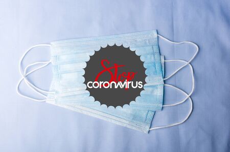 Background for news about the novel coronavirus COVID-19 - protective medical masks, thermometer and text Coronavirus COVID-19. Chinese coronavirus outbreak, Middle East respiratory syndrome coronavirus.の写真素材