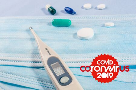 Background for news about the novel coronavirus COVID-19 - protective medical masks, thermometer and text Coronavirus COVID-19. Chinese coronavirus outbreak, Middle East respiratory syndrome coronavirus.の写真素材