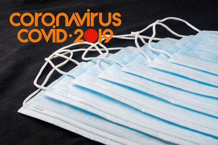 Background for news about the novel coronavirus COVID-19 - protective medical masks, thermometer and text Coronavirus COVID-19. Chinese coronavirus outbreak, Middle East respiratory syndrome coronavirus.の写真素材