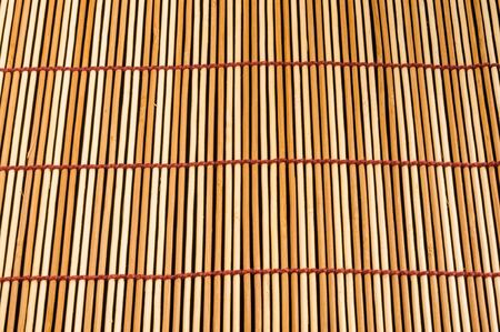 brown bamboo Mat - stand food, close-up, macro, black backgroundの写真素材
