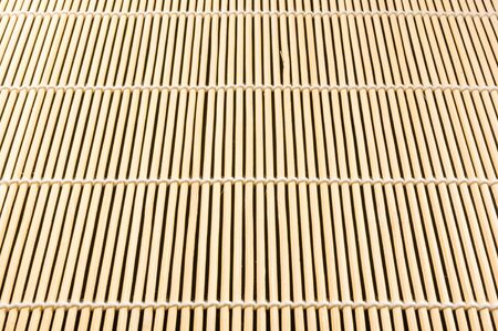 brown bamboo Mat - stand food, close-up, macro, black backgroundの写真素材