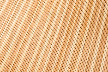brown bamboo Mat - stand food, close-up, macro, black backgroundの写真素材