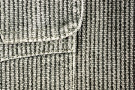 clothing items washed cotton fabric texture with seams, clasps, buttons and rivets, macro, close-upの写真素材