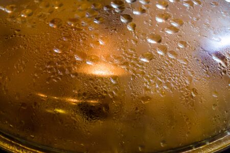 Preparation of Uzbek pilaf - evaporation of water from rice, close-upの写真素材