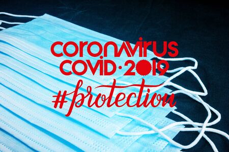 Background for news about the novel coronavirus COVID-19 - protective medical masks, thermometer and text Coronavirus COVID-19, lettering tag protection.の写真素材