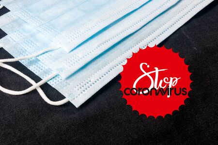 Background for news about the novel coronavirus COVID-19 - protective medical masks, thermometer and text Coronavirus COVID-19.の写真素材