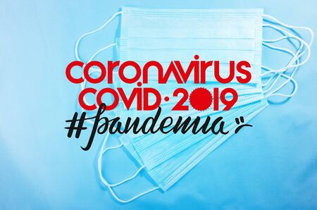 Background for news about the novel coronavirus COVID-19 - protective medical masks, thermometer and...