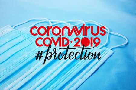 Background for news about the novel coronavirus COVID-19 - protective medical masks, thermometer and text Coronavirus COVID-19, lettering tag protection.の写真素材