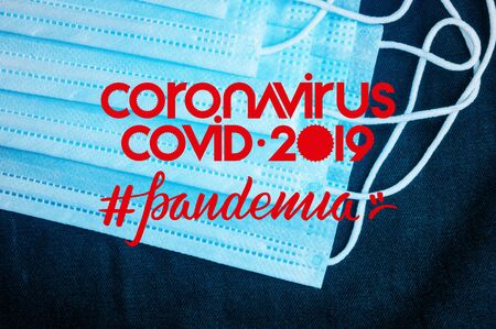 Background for news about the novel coronavirus COVID-19 - protective medical masks, thermometer and text Coronavirus COVID-19, lettering tag pandemia. Coronavirus outbreak, Middle East respiratory syndrome coronavirus.の写真素材