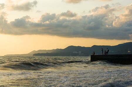 Summer sea sunset, the sun, waves and clouds, beautiful dramatic lightingの写真素材