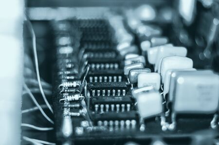 Vintage electronic circuit boards with radio parts and chips, close-up, macro photographyの写真素材