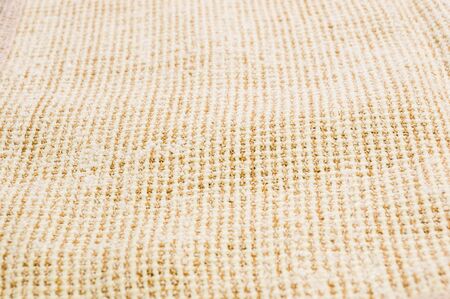 texture of light rustic coarse canvas fabric, close-up, backgroundの写真素材
