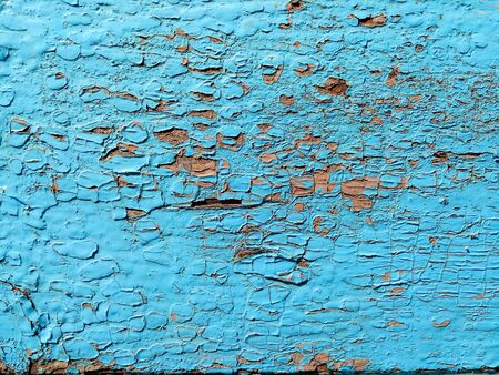 texture of old painted shabby rustic wooden fence made of planks, with rusty nails, close-up, grunge backgroundの写真素材